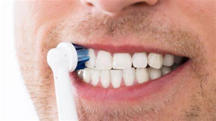 Should toothbrush touch gums?